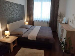 Postel nebo postele na pokoji v ubytování Apartmán pod hradem