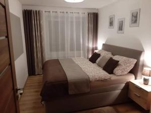 Postel nebo postele na pokoji v ubytování Apartmán pod hradem