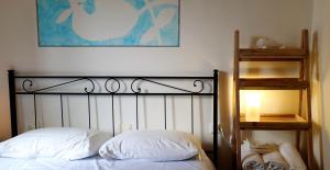 a bedroom with a bed and a lamp at B&B Da Beppe in Corniglia