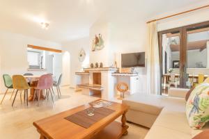 a living room with a couch and a table at Appartement Altamira Orihuela Costa Golf, Las Ramblas in Orihuela Costa