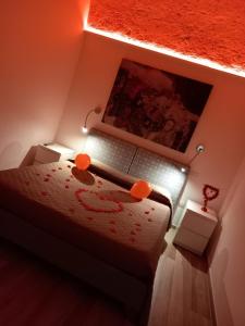 a bedroom with a bed with orange balloons on it at Room 26 - B&B Altamura in Altamura
