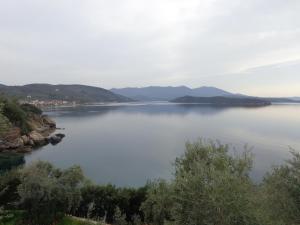 a view of a lake with mountains in the distance at Sea Front in Milina
