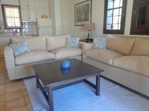 a living room with two couches and a coffee table at Sea Front in Milina