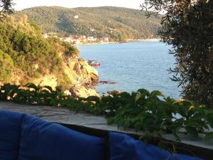 a view of a body of water with a mountain at Sea Front in Milina