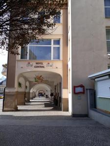 a building with a walkway in front of a building at Penzion Hotelu Central in Dvůr Králové nad Labem