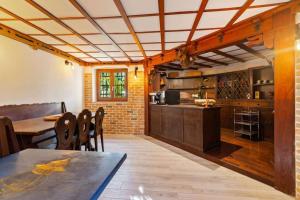 a large kitchen with a table and a counter at Villa Vale in Sanremo