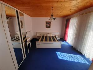 מיטה או מיטות בחדר ב-Fődi apartman