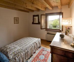 Postel nebo postele na pokoji v ubytování B&B Il Pettirosso
