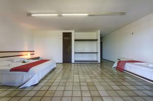 Una cama o camas en una habitación de Casa no centro de Cumbuco por Carpediem