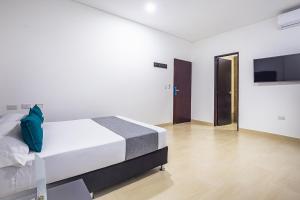 Ayenda Hotel Trinidad客房内的一张或多张床位