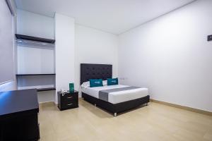 Ayenda Hotel Trinidad客房内的一张或多张床位