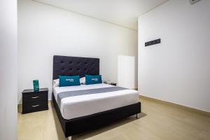 Ayenda Hotel Trinidad客房内的一张或多张床位