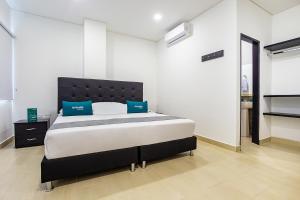 Ayenda Hotel Trinidad客房内的一张或多张床位
