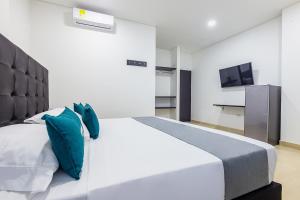 Voodi või voodid majutusasutuse Ayenda Hotel Trinidad toas