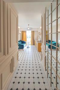 a room with a hallway with a room with a floor at Boutique Apartment - Signature in Kutaisi