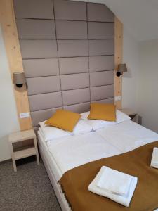 Posteľ alebo postele v izbe v ubytovaní Karolowy pokoje&apartamenty