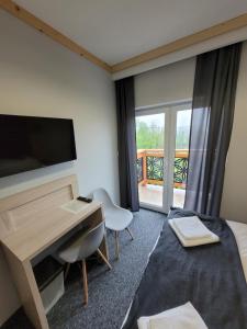 TV a/nebo společenská místnost v ubytování Karolowy pokoje&apartamenty
