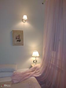 A bed or beds in a room at Casa Vacanza Villa Filomena