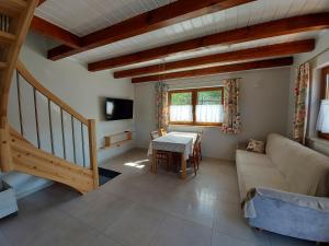 a living room with a couch and a table at Agroturystyka Pod Klonem in Wąglikowice