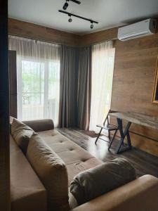 a living room with a couch and a table at Kambodzha na Dynae in Vylkove +149 photos