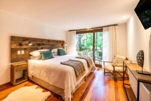 Postel nebo postele na pokoji v ubytování Rakau Lodge
