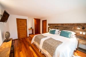 Postel nebo postele na pokoji v ubytování Rakau Lodge