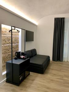 Χώρος καθιστικού στο Toledo Boutique Rooms