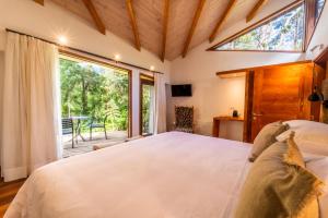 Postel nebo postele na pokoji v ubytování Rakau Lodge