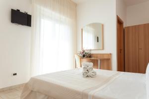 Postel nebo postele na pokoji v ubytování Adria Beach Hotel
