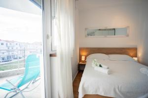 Posteľ alebo postele v izbe v ubytovaní Apartman Aqua + 37 fotografií