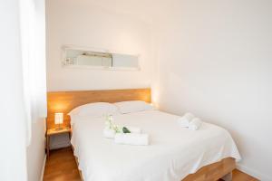 Posteľ alebo postele v izbe v ubytovaní Apartman Aqua