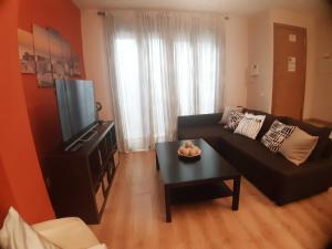 Televízia a/alebo spoločenská miestnosť v ubytovaní Apartamento centro Málaga