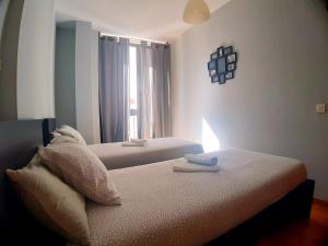Łóżko lub łóżka w pokoju w obiekcie Apartamento centro Málaga