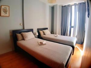 Łóżko lub łóżka w pokoju w obiekcie Apartamento centro Málaga