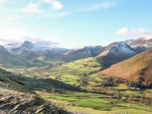 a view of a valley with mountains in the background at Tree Tops View in Windermere