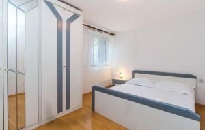 Ein Bett oder Betten in einem Zimmer der Unterkunft Apartments Vukelic