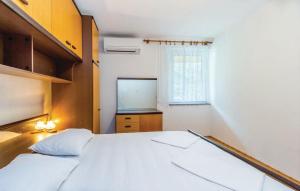 Ein Bett oder Betten in einem Zimmer der Unterkunft Apartments Vukelic