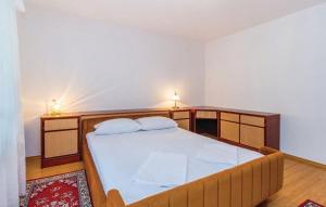Ein Bett oder Betten in einem Zimmer der Unterkunft Apartments Vukelic
