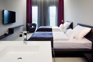 Postel nebo postele na pokoji v ubytování Miura Hotel + 33 fotografií