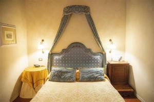 Postel nebo postele na pokoji v ubytování Hotel Clitunno
