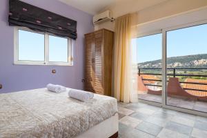 Postel nebo postele na pokoji v ubytování Zenia Villa + 21 fotografií