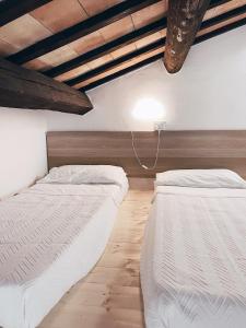 Postel nebo postele na pokoji v ubytování Agriturismo La Rustica