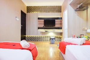 Voodi või voodid majutusasutuse RedDoorz Plus @ Simpang USU Medan toas