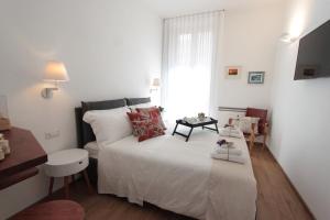 A bed or beds in a room at Palazzo Pinto B&B