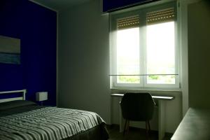 A bed or beds in a room at Le rose di Bino
