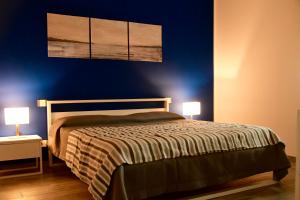 A bed or beds in a room at Le rose di Bino