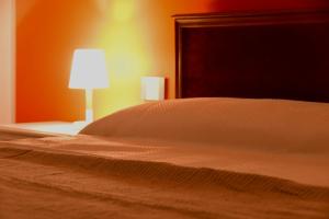 A bed or beds in a room at Le rose di Bino