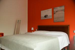 A bed or beds in a room at Le rose di Bino