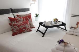 A bed or beds in a room at Palazzo Pinto B&B