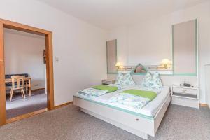 A bed or beds in a room at Seeappartements Bacher